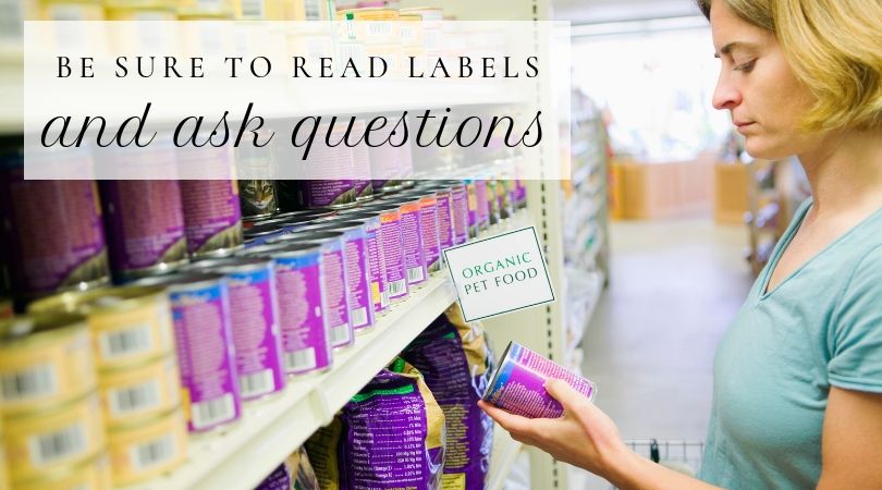 Woman in store reading cat food label