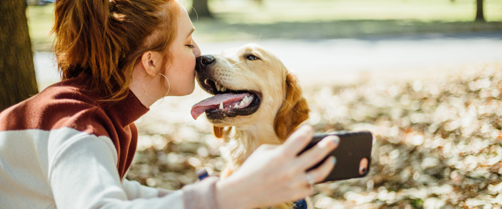 Woman taking a selfie with her dog